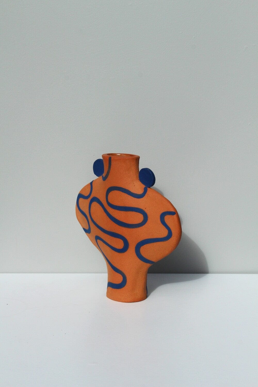 Hand Drawn Vessel In Terracotta And Blue.