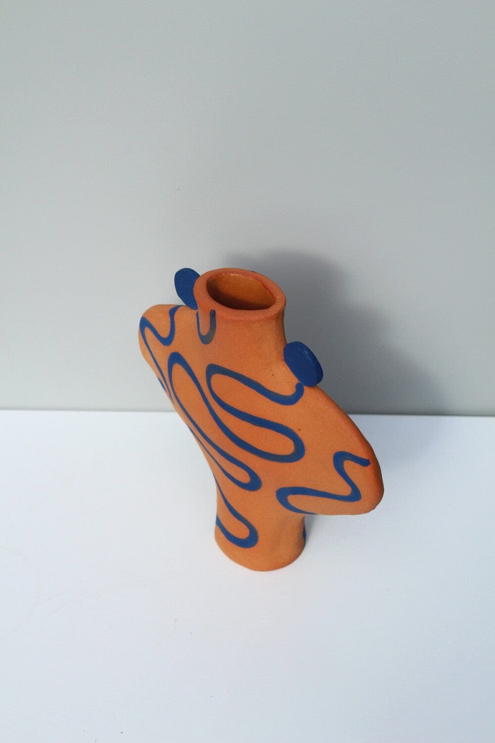 Hand Drawn Vessel In Terracotta And Blue.