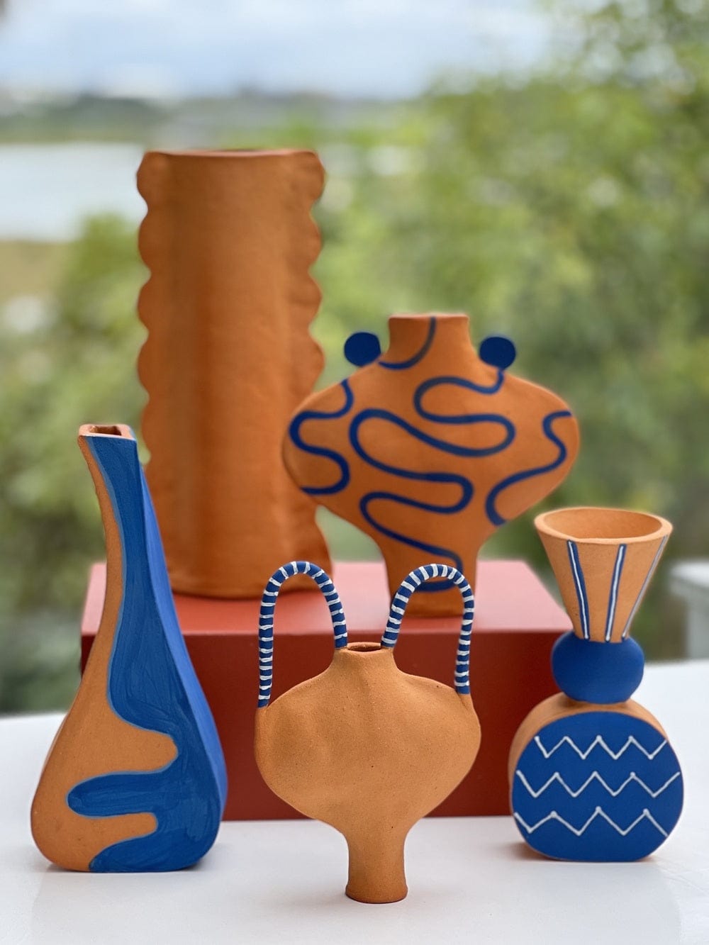 Hand Drawn Vessel In Terracotta And Blue.